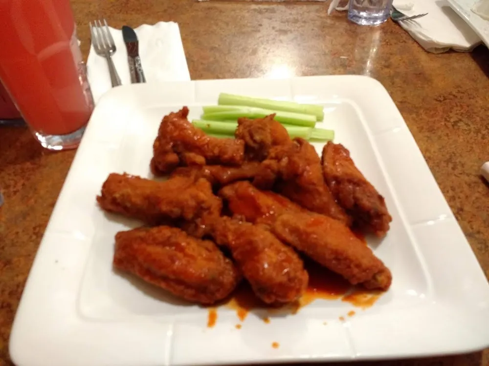 Buffalo Chicken Tenders with Celery Sticks Served with Bleu Cheese